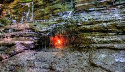You Can Visit This Eternal Flame Flickering Under A Waterfall